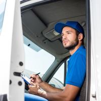Pest Inspector in Car with Clip-board