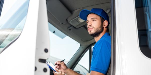 Pest Inspector in Car with Clip-board